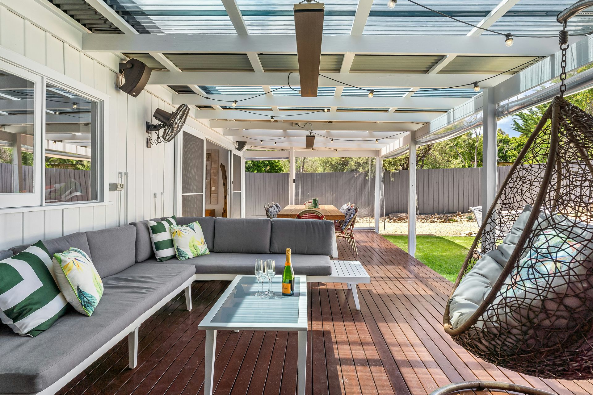 A porch with a hammock and a couch